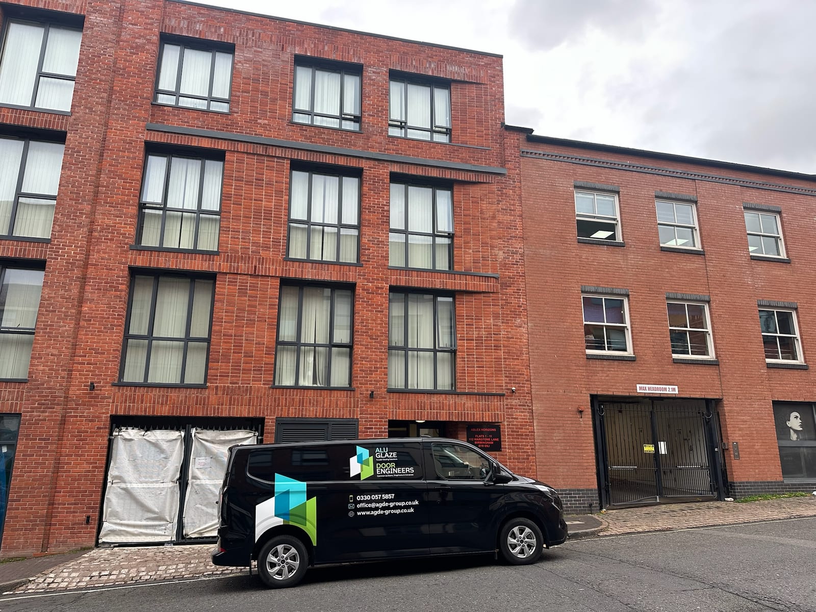 Door Engineers branded service van parked at a commercial premises in Birmingham
