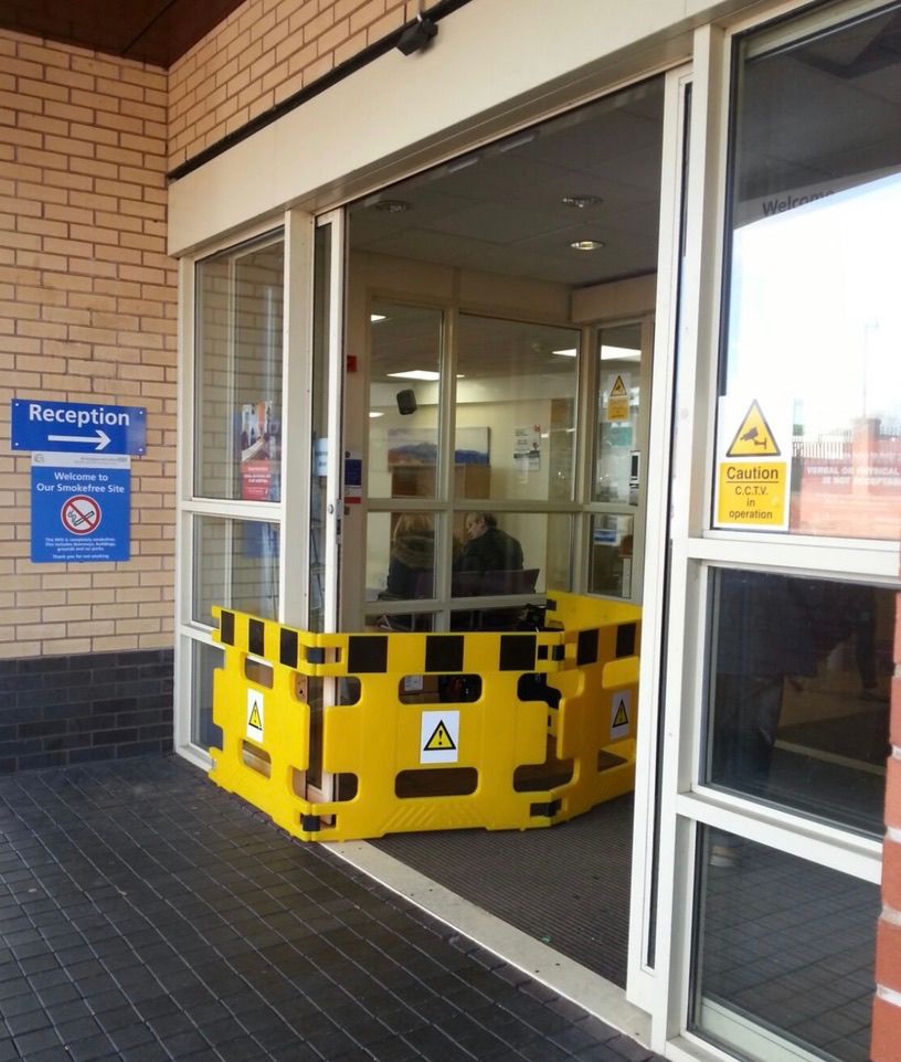 Automatic door operator servicing and adjustment on a commercial entrance