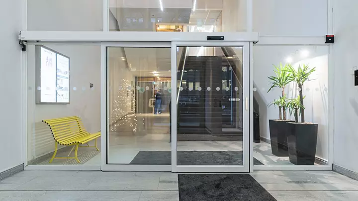 Automatic Single Slide Door System At A Commercial Entrance