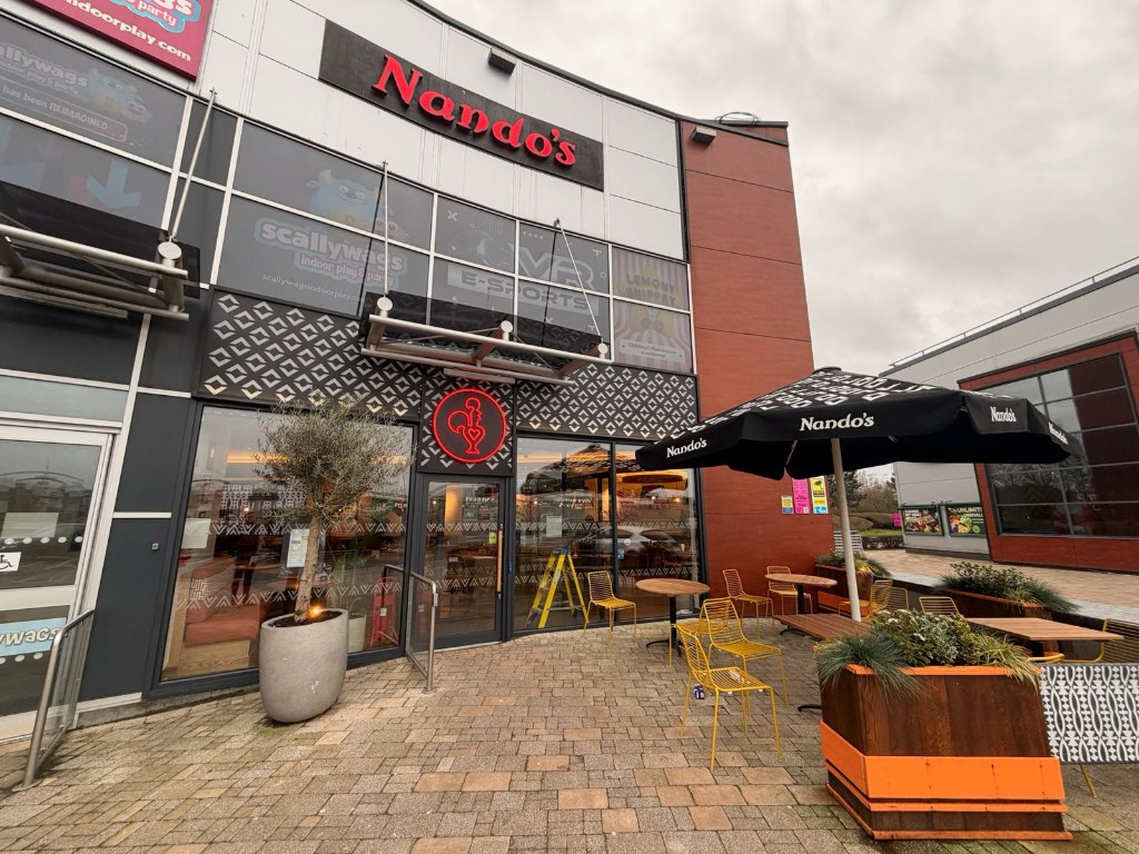 Record DFA 127 automatic swing door on the Nando's entrance at Fort Shopping Park with external barrier-mounted push button
