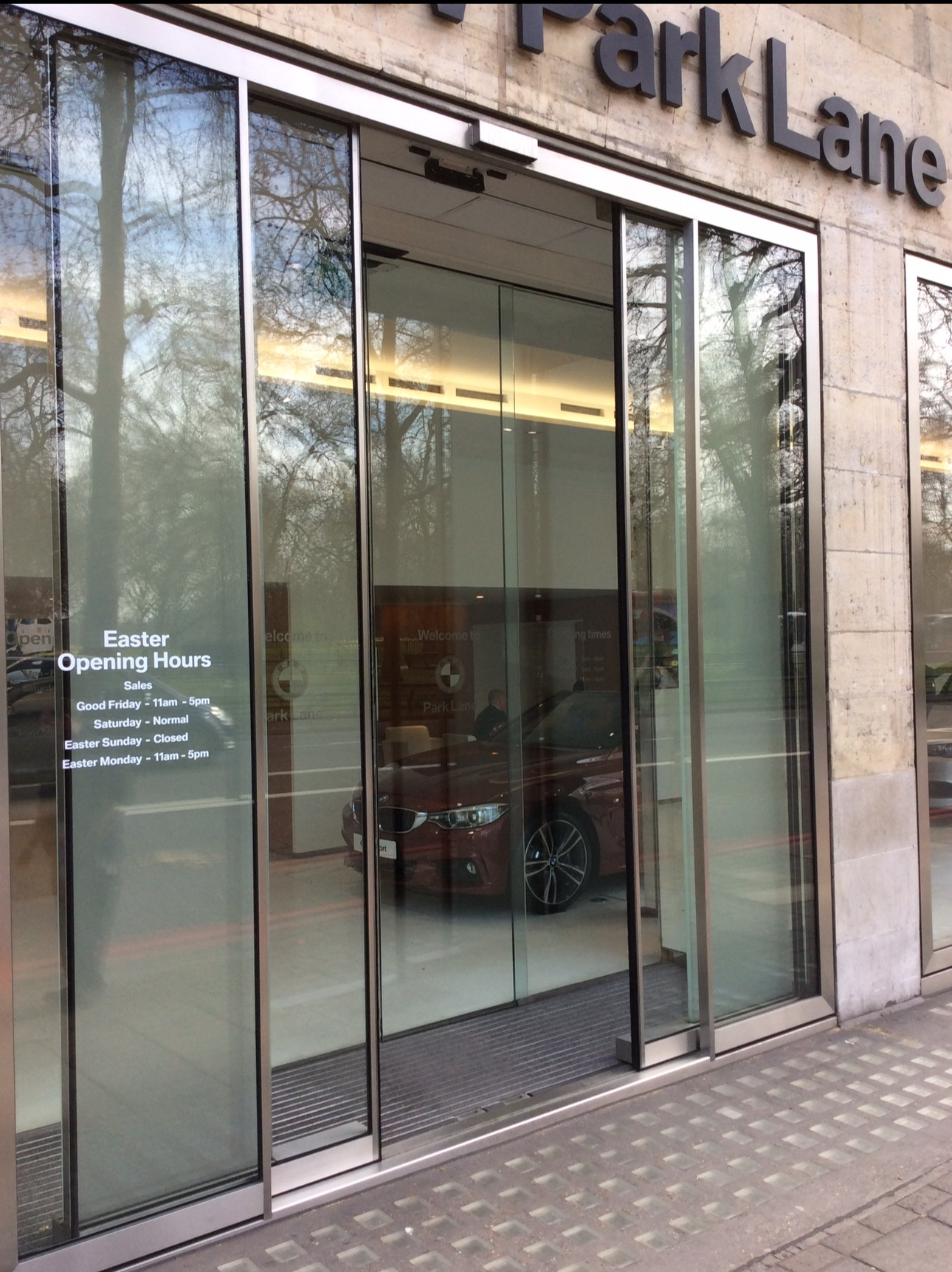 Automatic sliding glass entrance doors at a commercial showroom