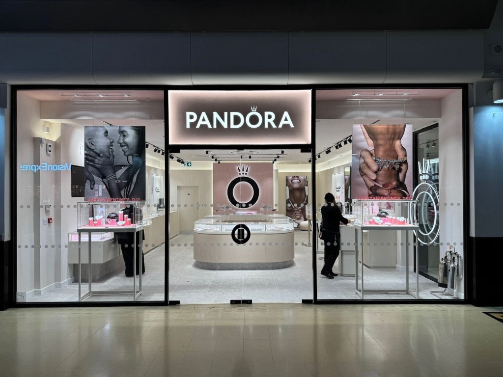 Frameless glass double doors with patch fittings at a Pandora retail shopfront entrance in a shopping centre