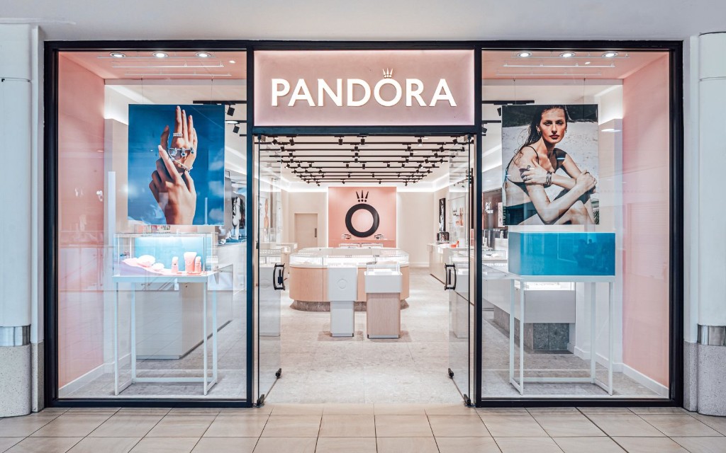 Double frameless toughened glass doors with black patch fittings & bespoke Pandora pull handles at Pandora Crystal Peaks in Sheffield