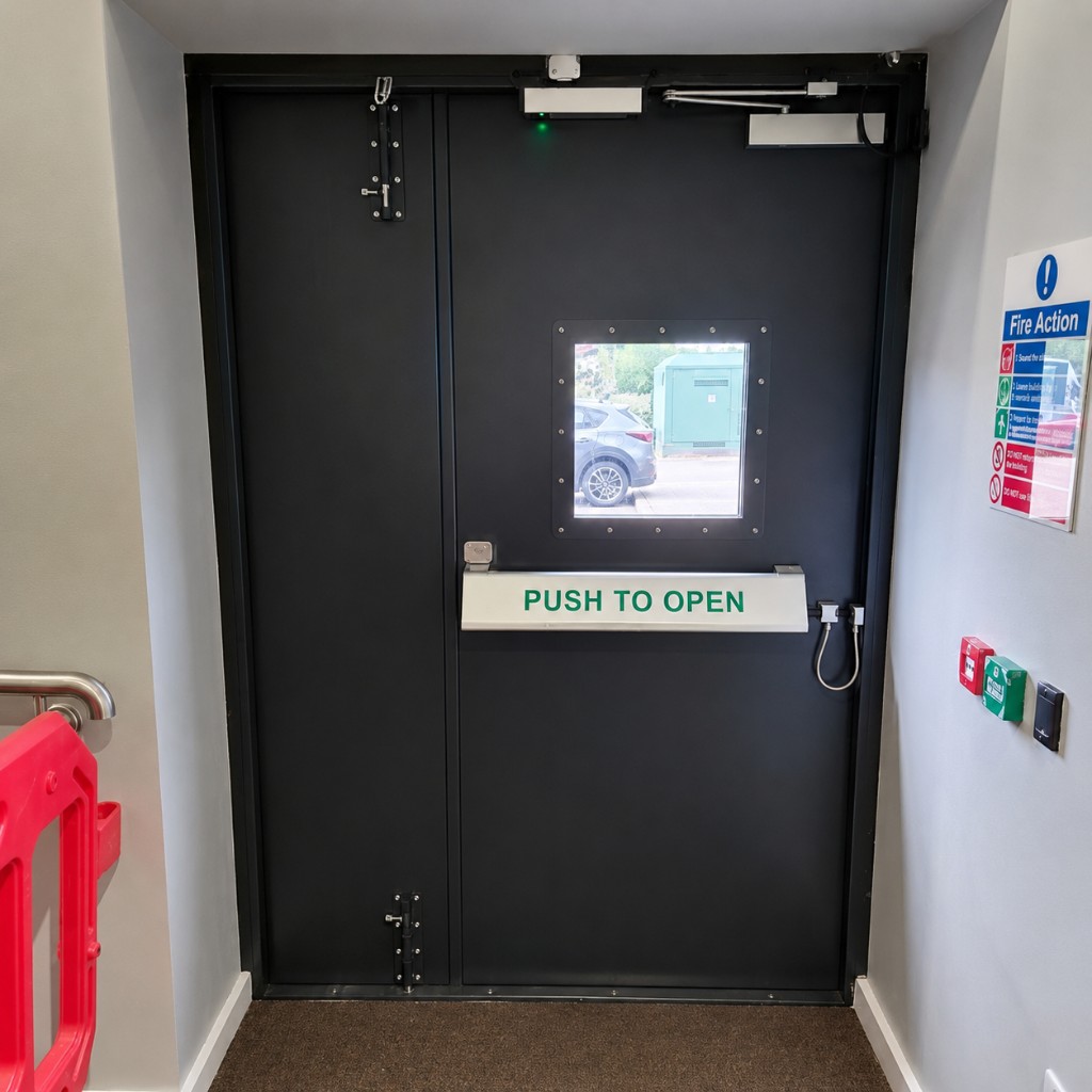 SR-rated double steel security door set with vision panel, panic bar & access control at Altecnic in Stafford