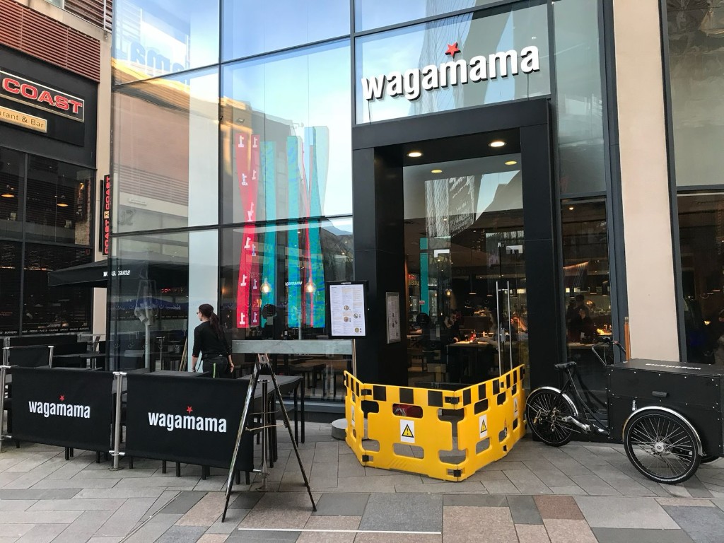 Commercial Glass Shopfront Entrance With Safety Barrier During Frameless Glass Door Maintenance Works