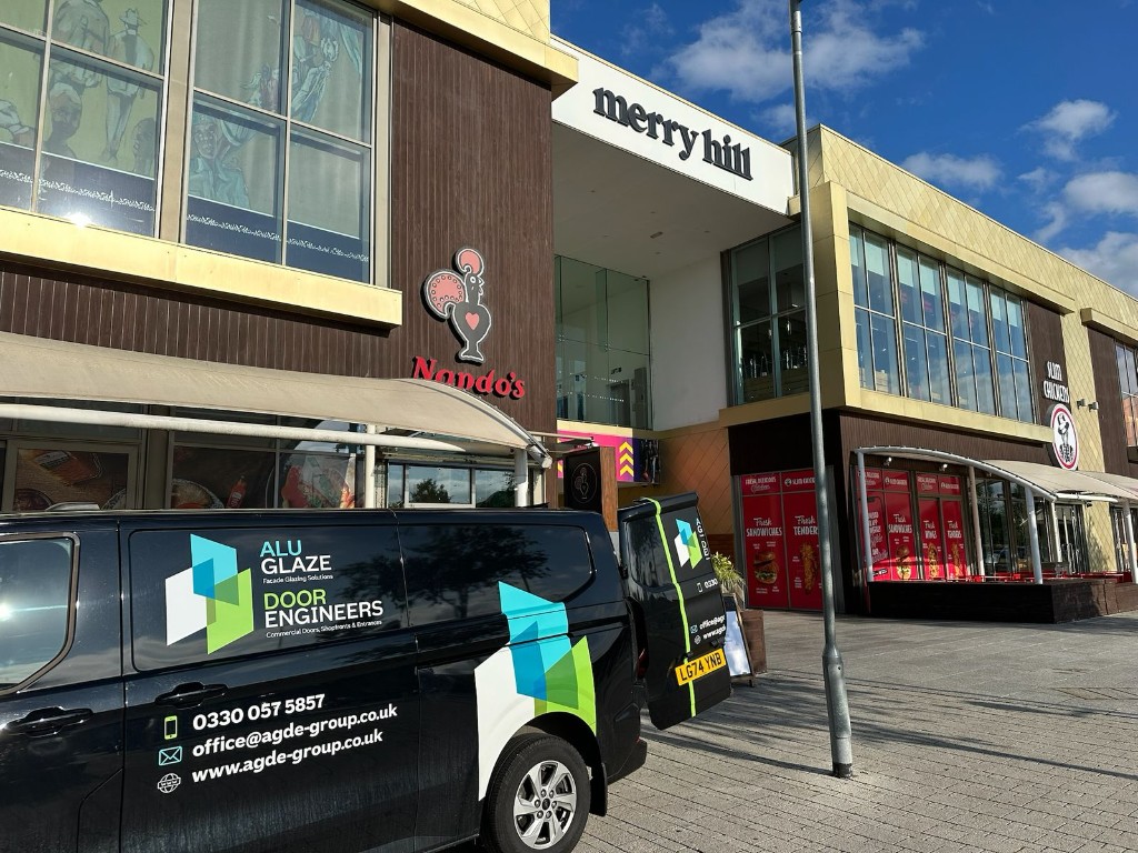 Door Engineers Branded Van At A Commercial Shopping Centre During Emergency Door Repair Attendance