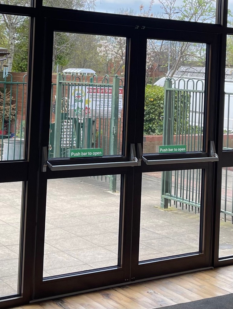 Double aluminium fire exit doors with push bars & push bar to open signage