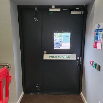 Steel fire exit double doors with panic bar, vision panel & emergency release hardware