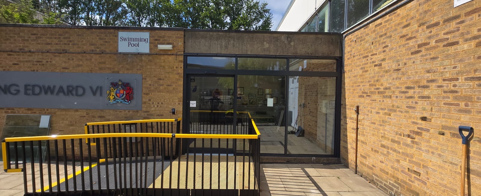 Commercial door maintenance engineer carrying out planned inspection works