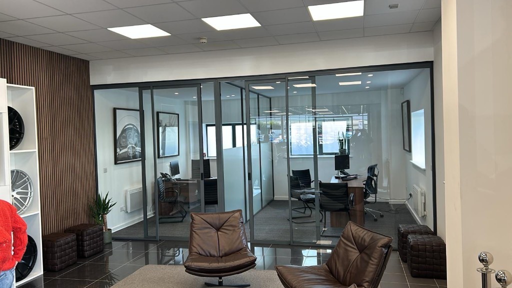 ID30 internal glazing with sliding doors at a prestige car showroom in Knaresborough
