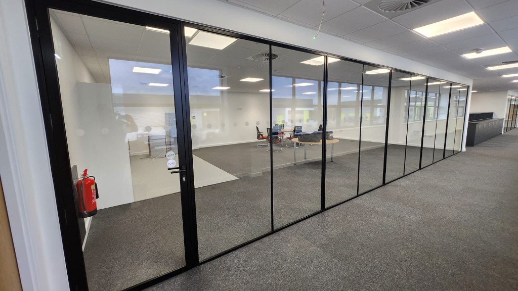 Long run of ID30 framed internal glazing with hinged doors at a commercial headquarters in Rayleigh